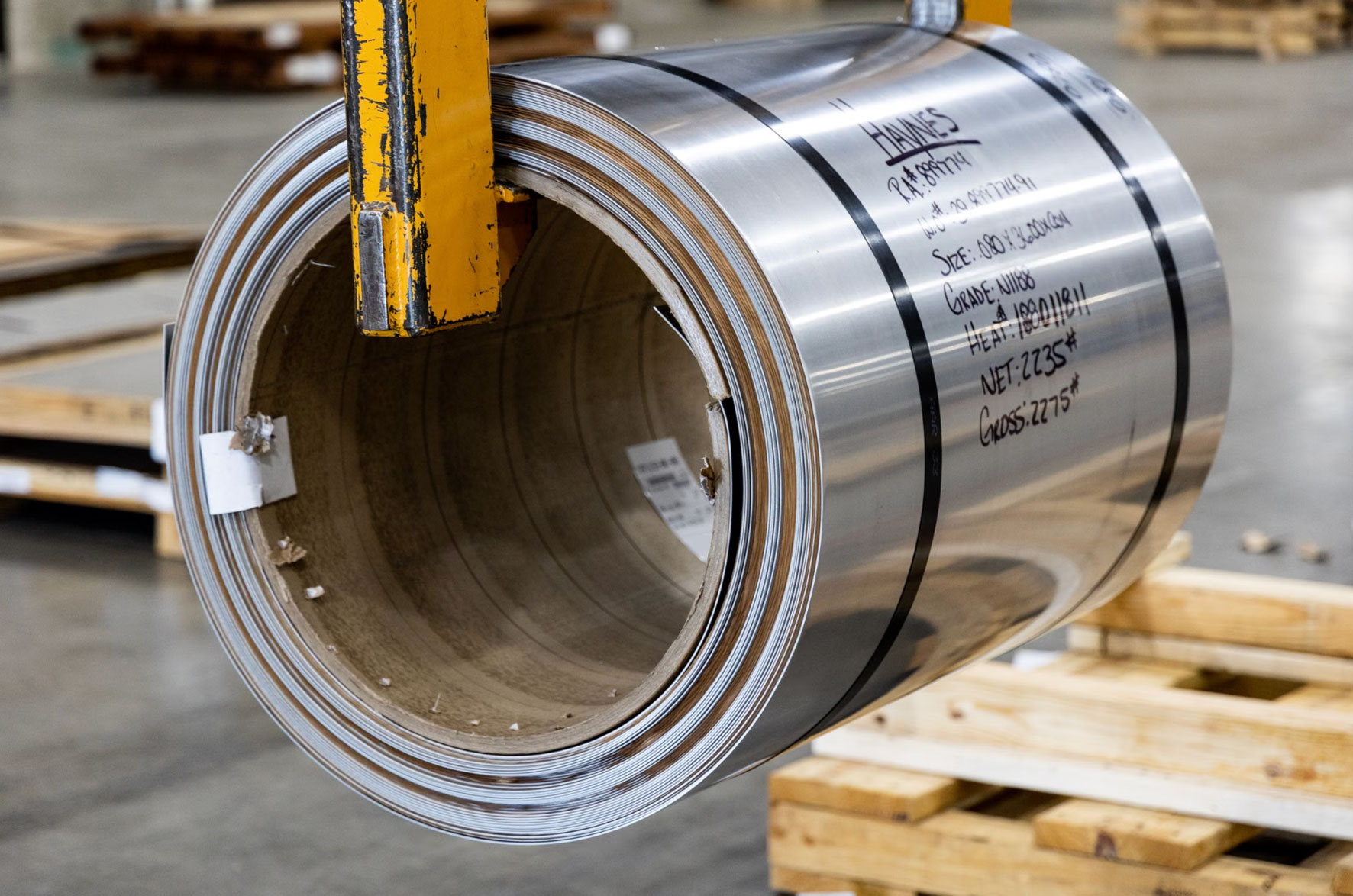 Steel coil stamped with grade, heat number and mill certification details
